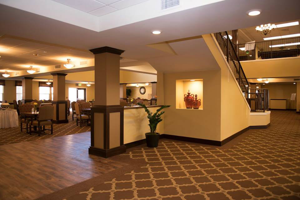 Staircase and dining room in Joshua Springs Senior Living.