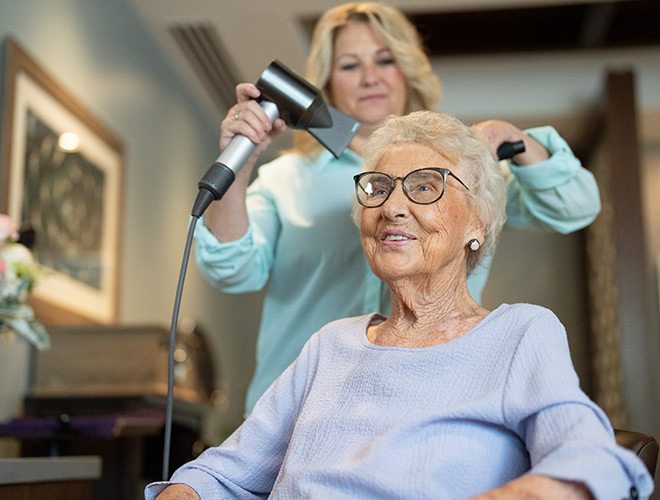 A person getting their hair dried.