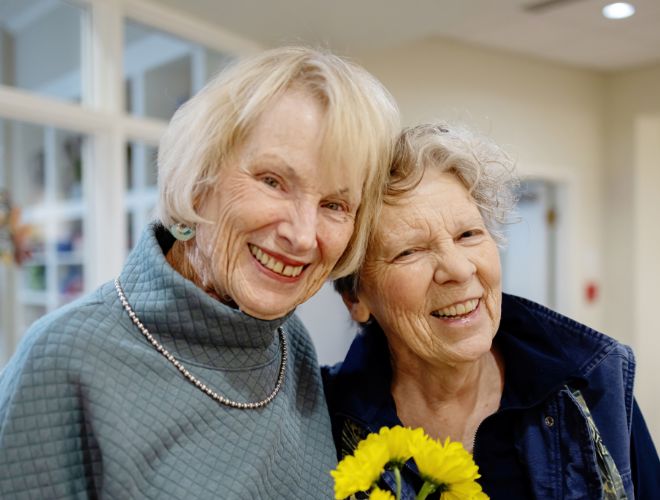 Two people smiling together.