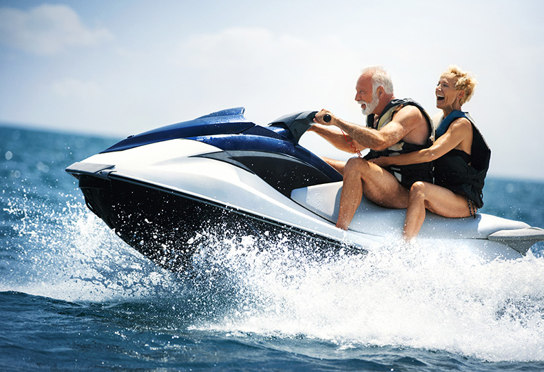 Two people riding a jet ski.