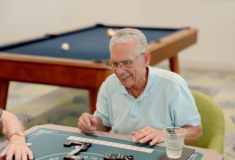 A person playing dominos.