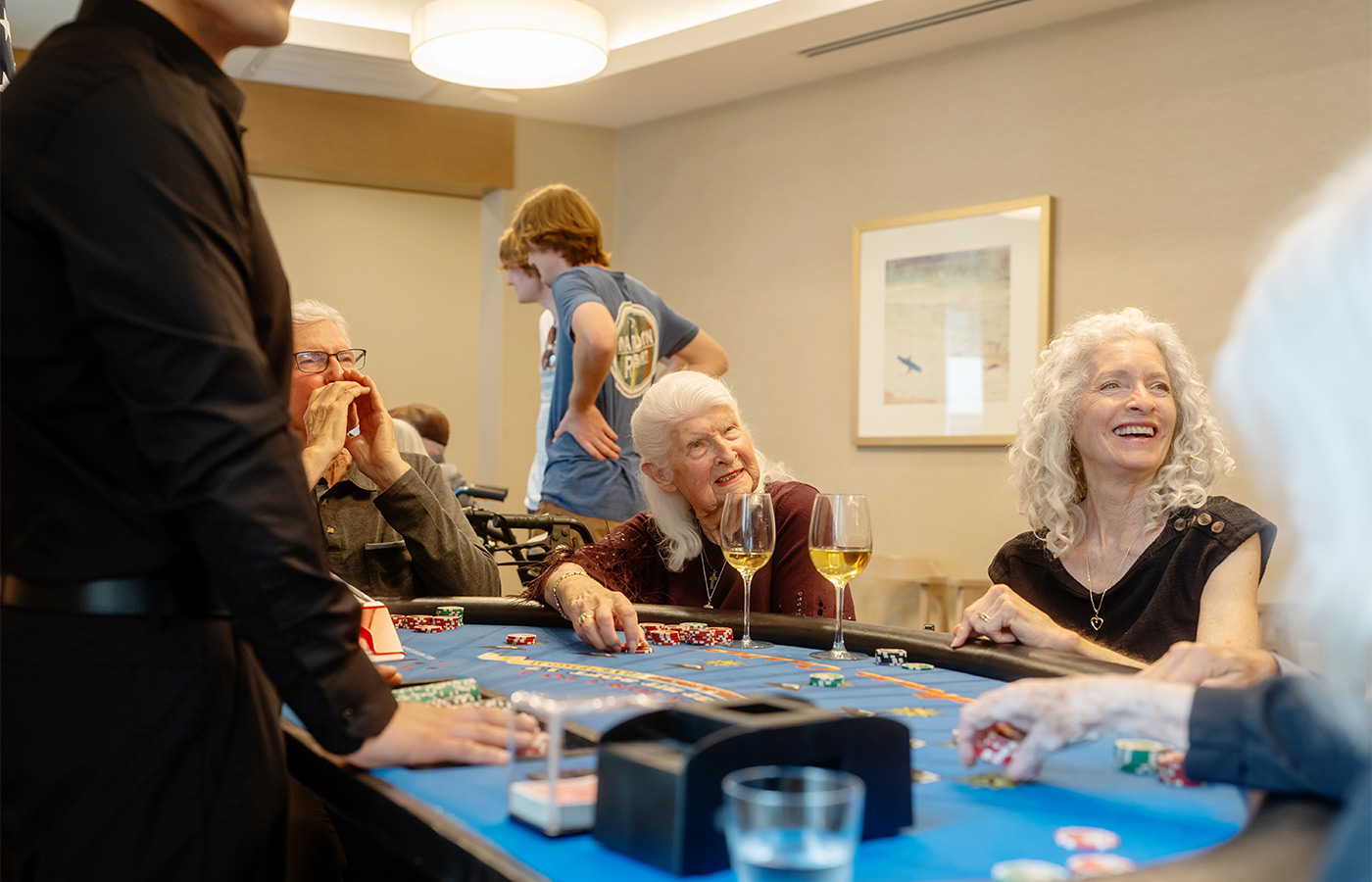 A group of people playing cards.