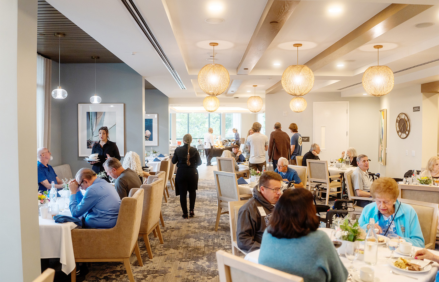 People eating in the dining room.