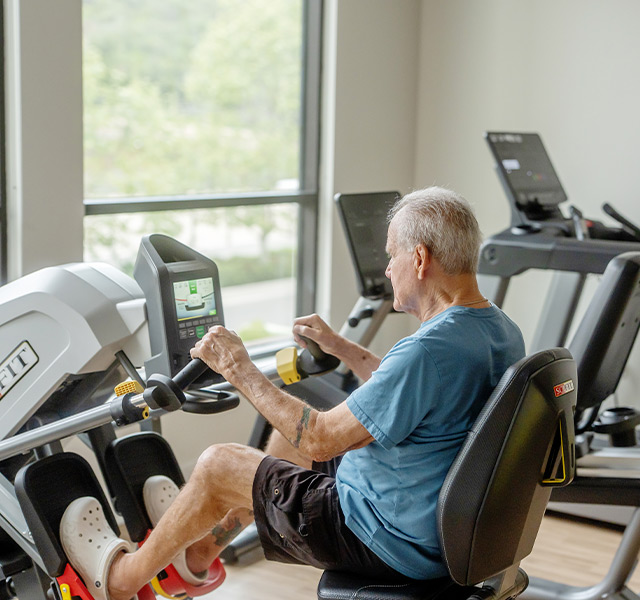 A person on a stationary bike.