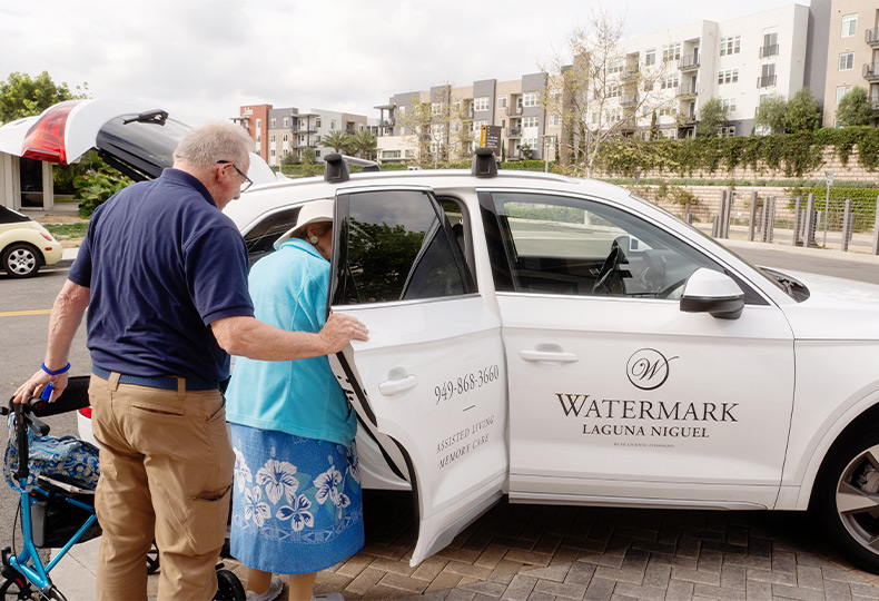 A person getting into a car.