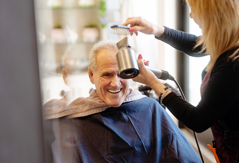 A person getting their hair dried.