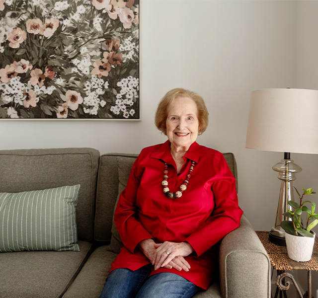 A person sitting on a couch.