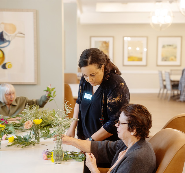 People arranging flowers.