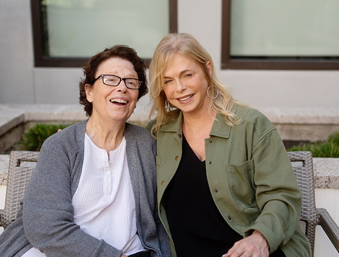 Two people laughing.