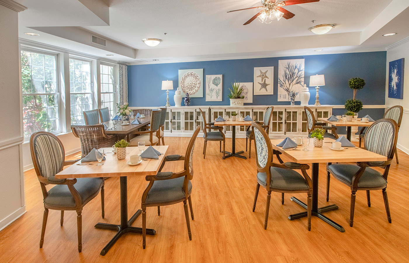 Dining Room with tables and chairs and a pretty hardwood floor.