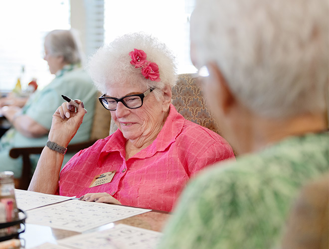 Residents enjoying bingo.