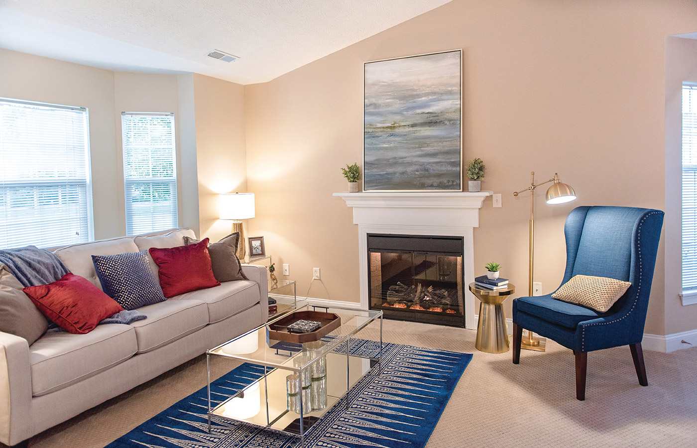 Furnished living room space with sofa, table, and seating area.