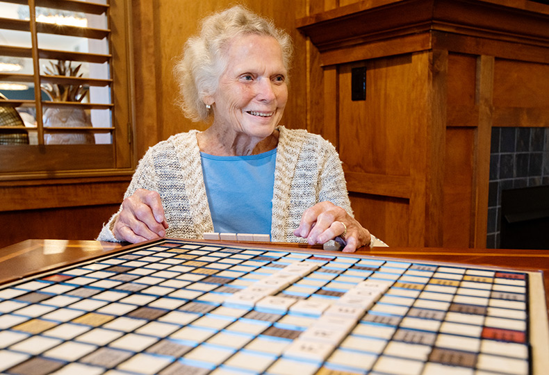 Resident enjoying a game of scrabble.