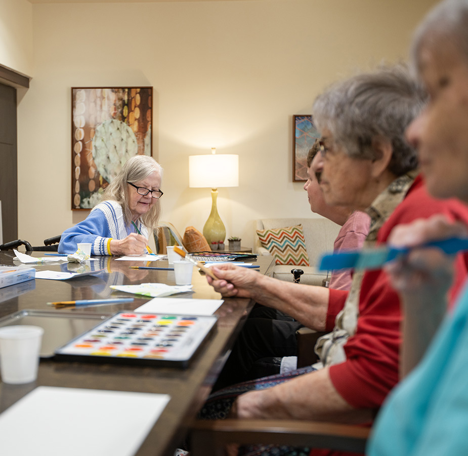 Residents enjoying an art class.