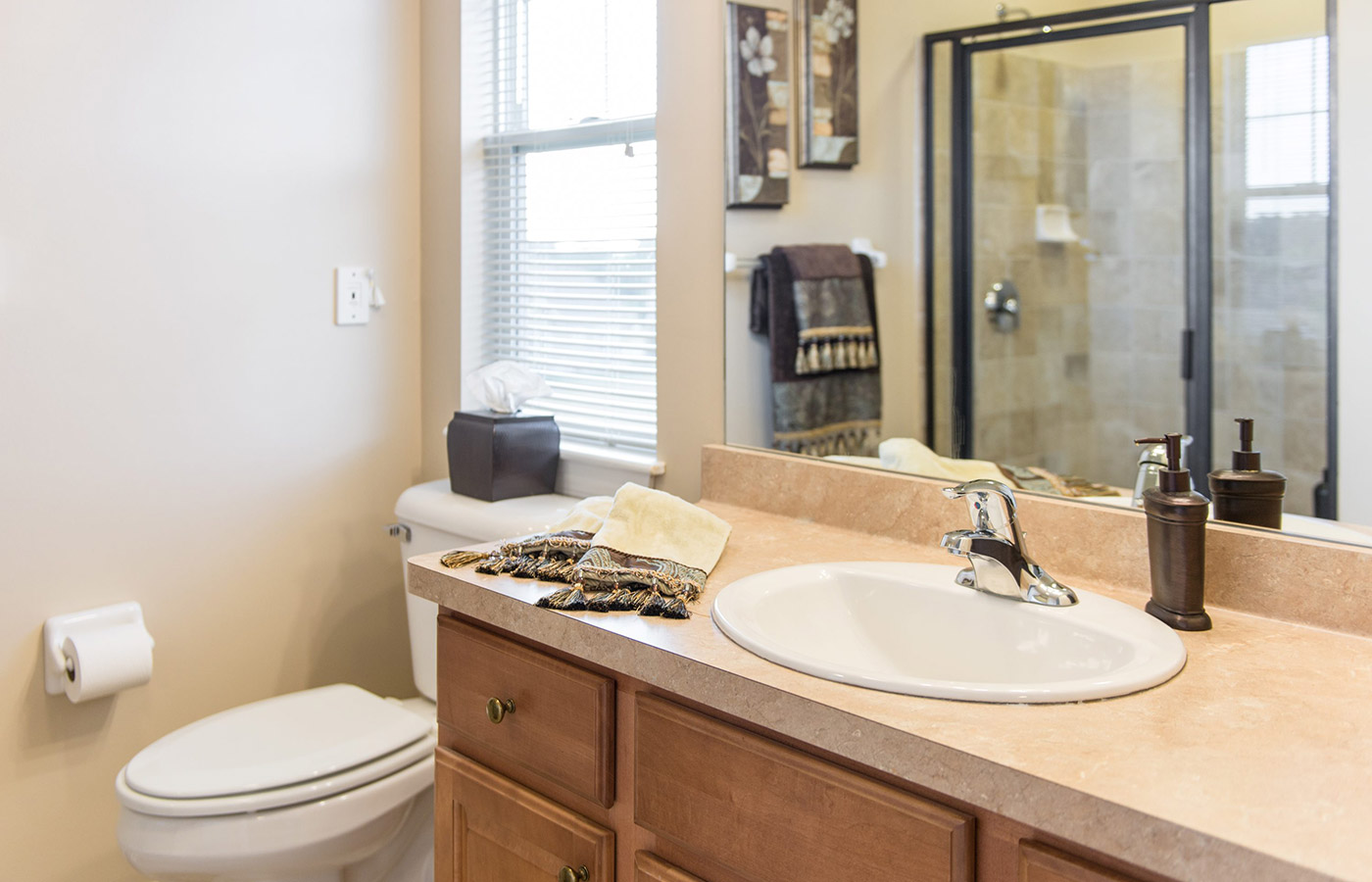 A bathroom in an apartment at The Legacy at Erie Station.
