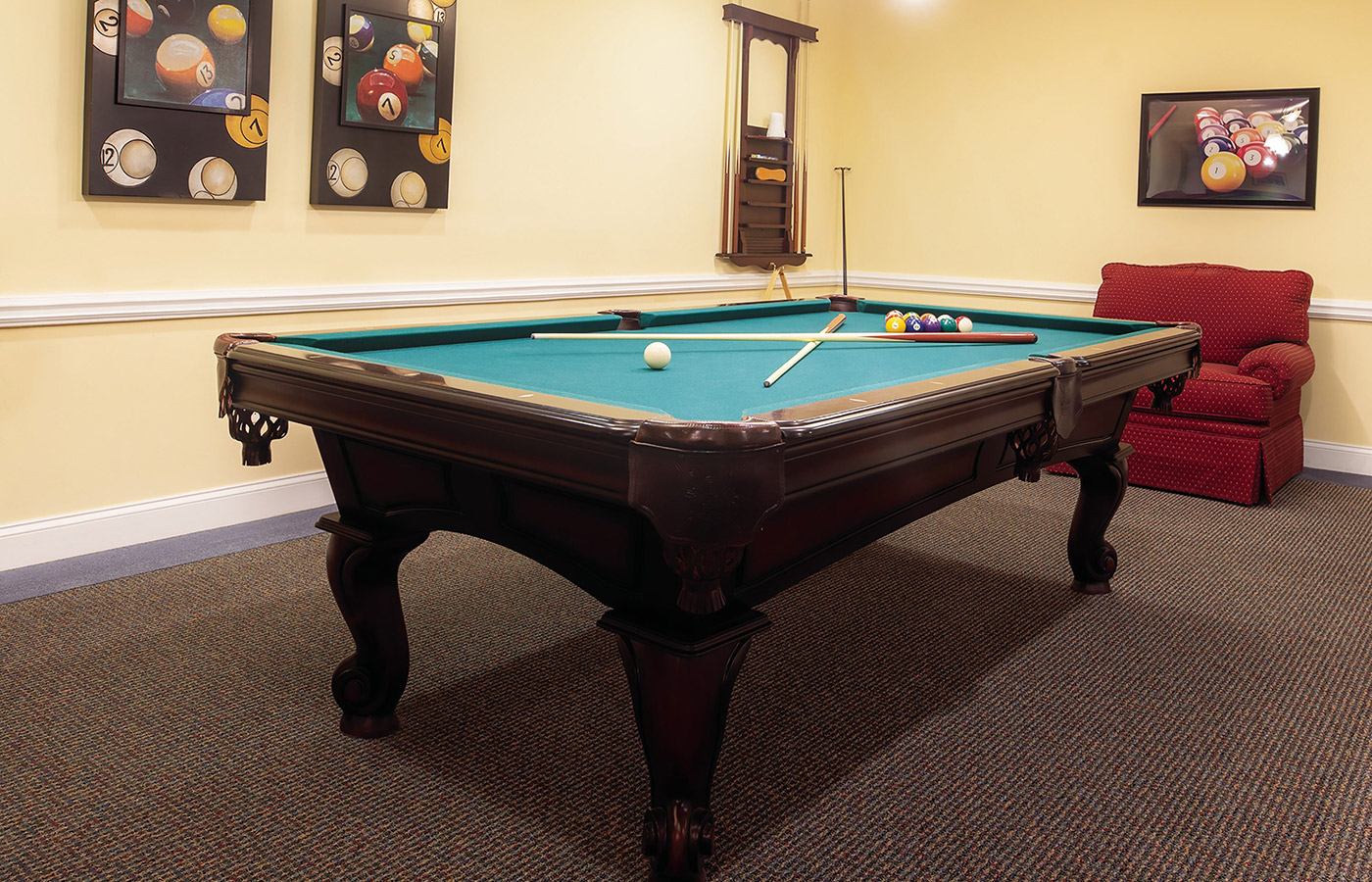 A pool table in a game room.