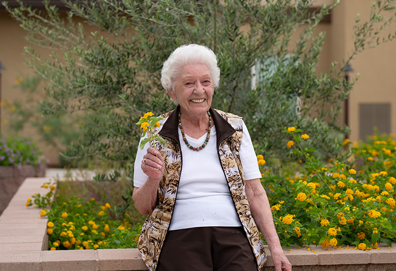 A person holding a flower.