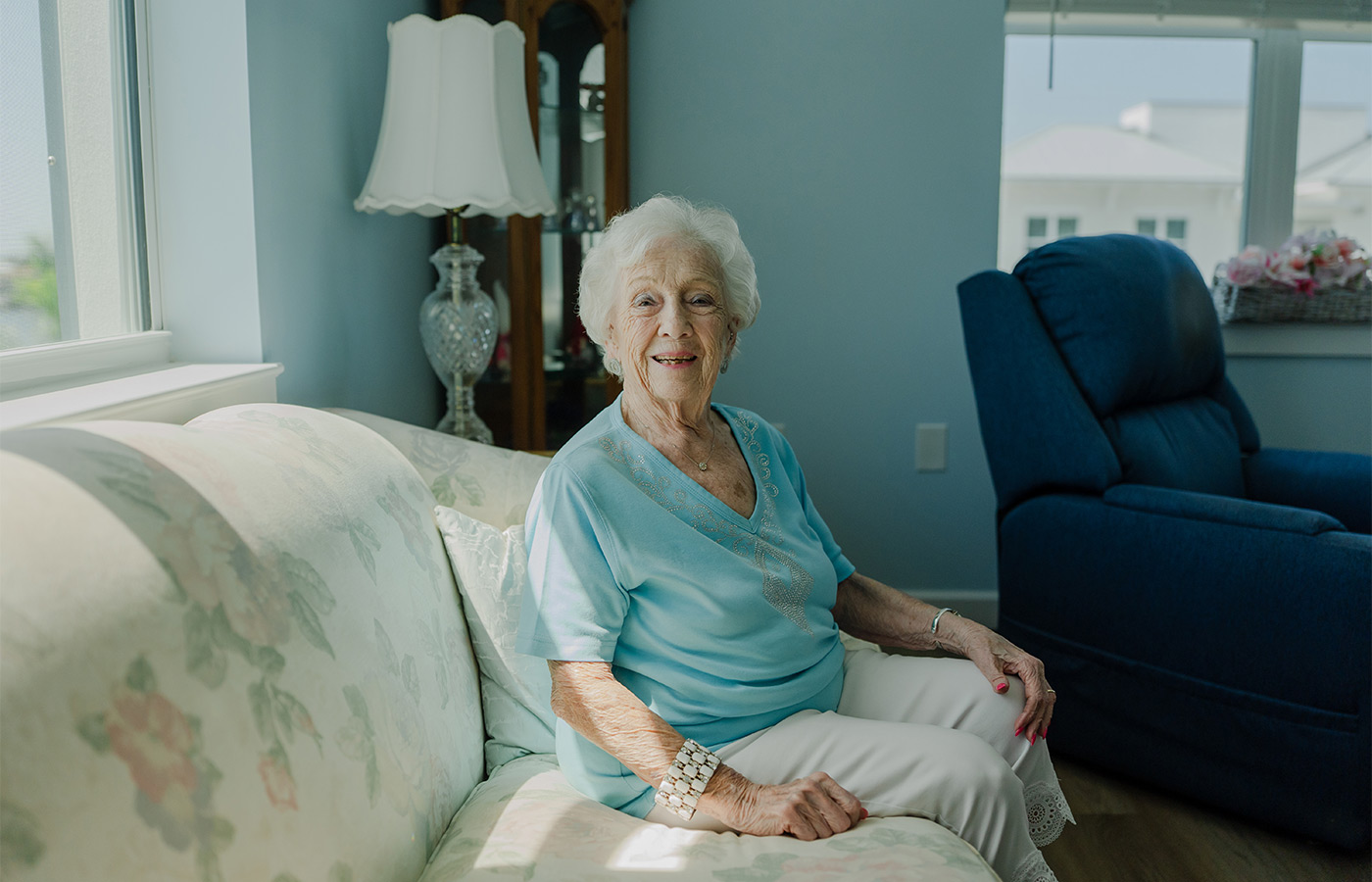 A person sitting on their couch.