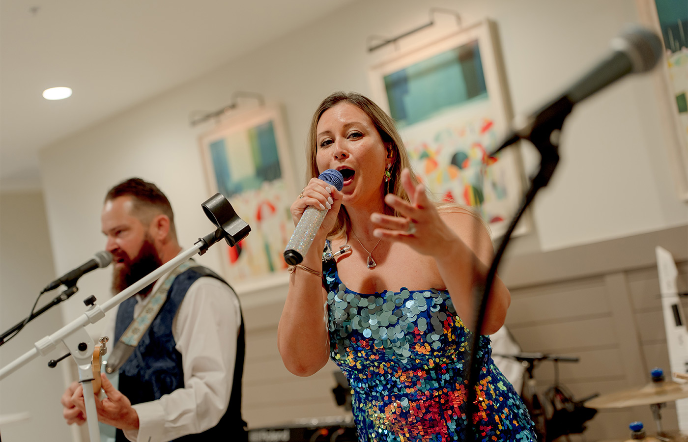 A person singing in a band.