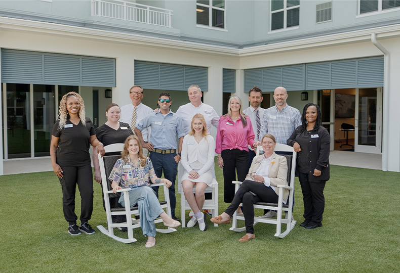 A group of people smiling.