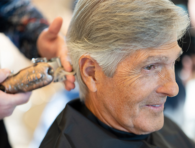 A person getting their hair cut.