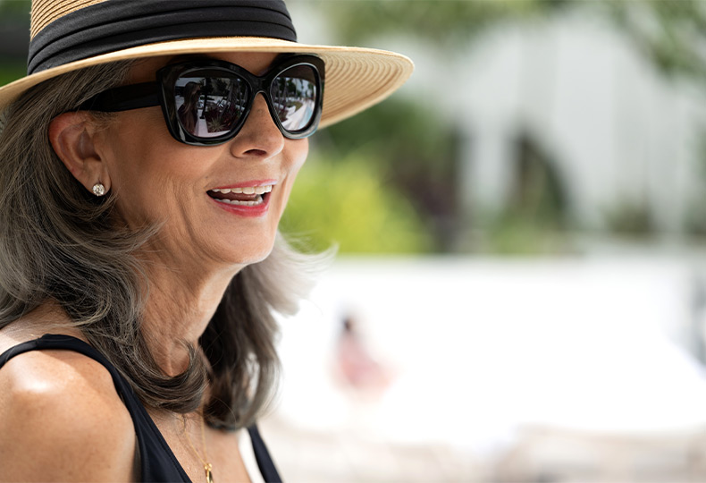 A person with a hat and sunglasses.