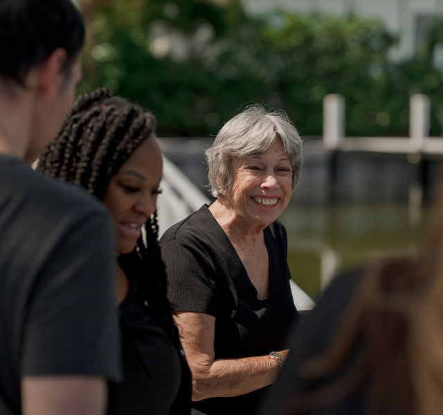 People smiling outside.