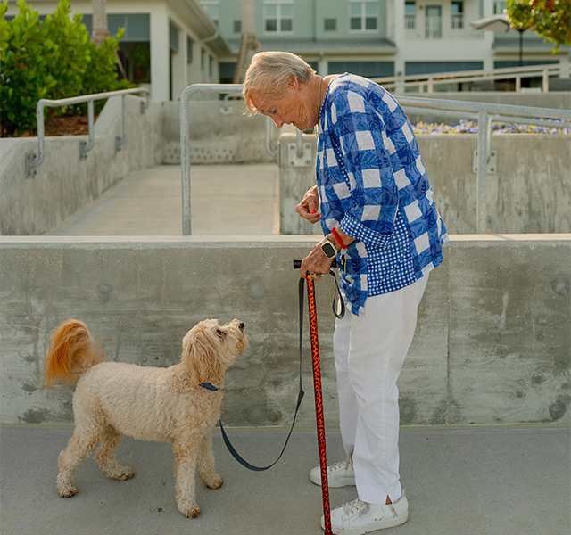 A person walking their dog.