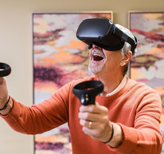 A resident enjoying VR goggles.