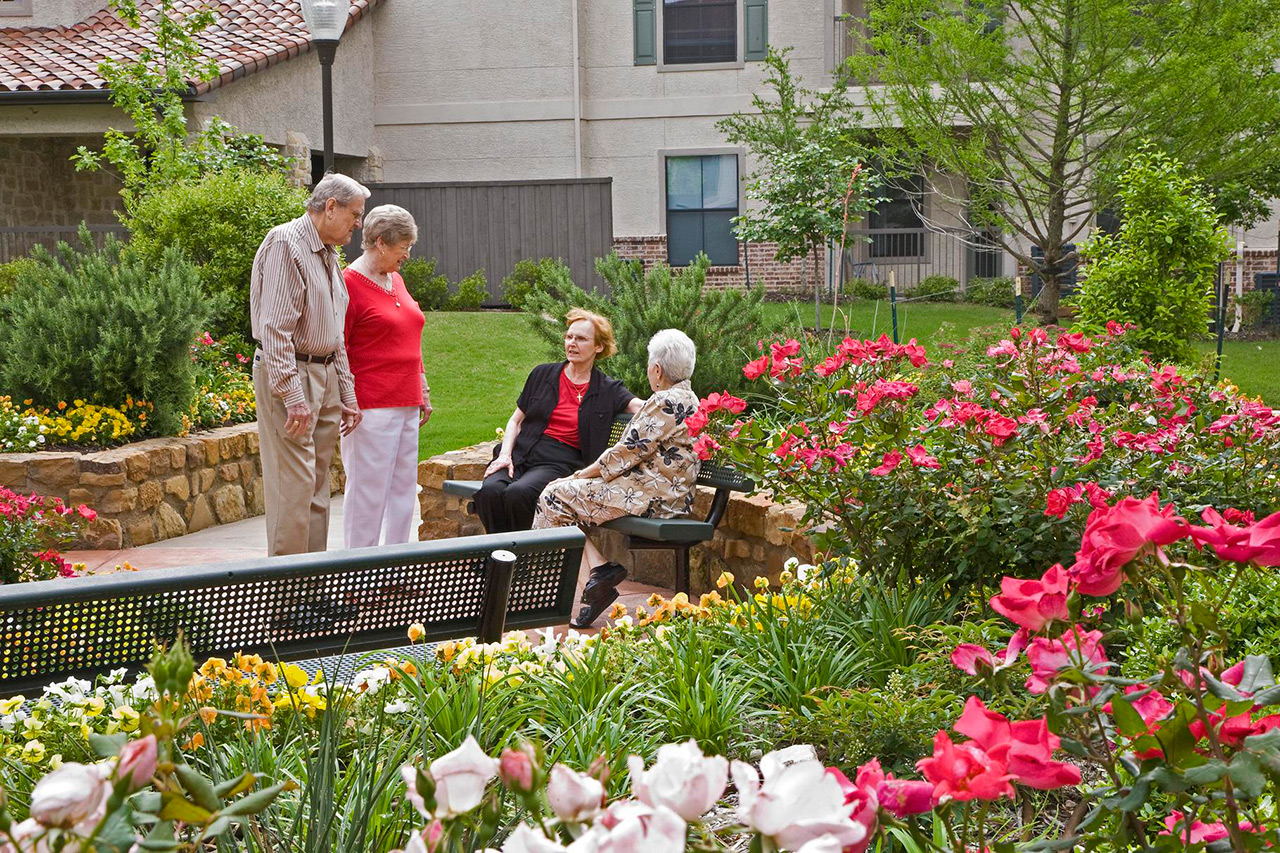 Parkview in Frisco garden with residents walking through.