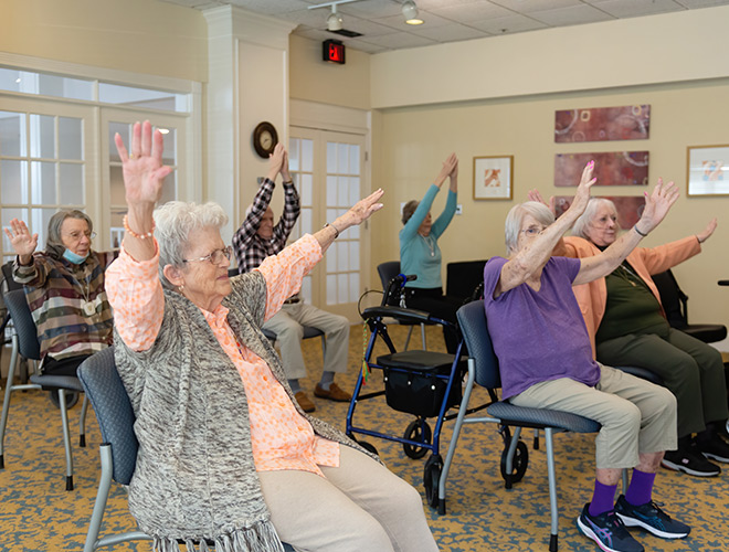 A seated group exercise class.
