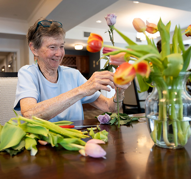 A person arranging flowers.