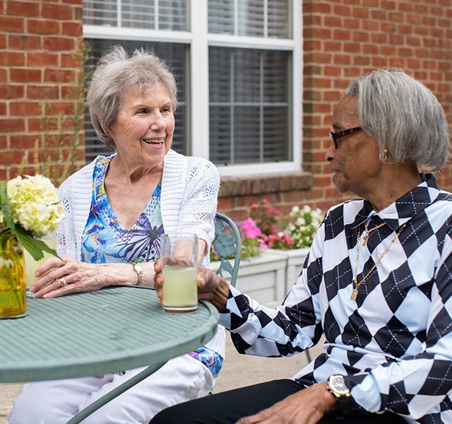 Friends having lemonade on the patio.