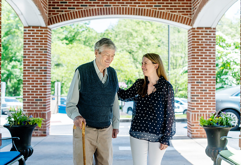 A resident walking in with an adult child.