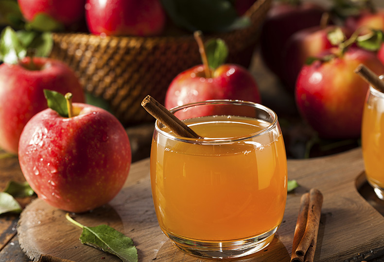 A glass of apple cider.