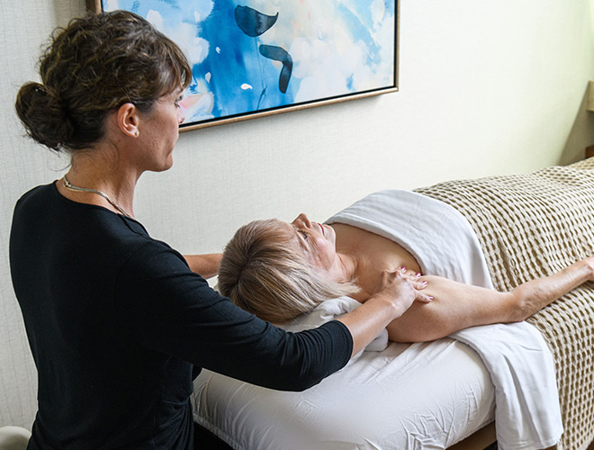 A resident gets a massage by a masseuse.