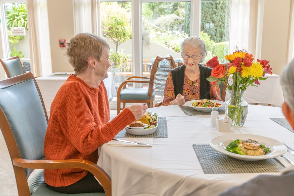 Residents are having a meal together.