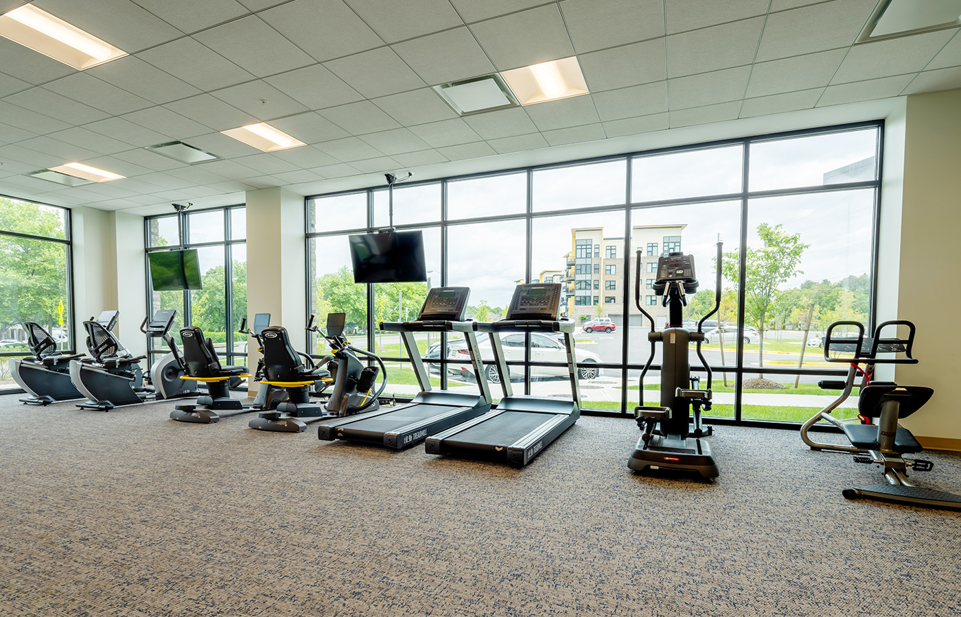 A fitness center with gym equipment.