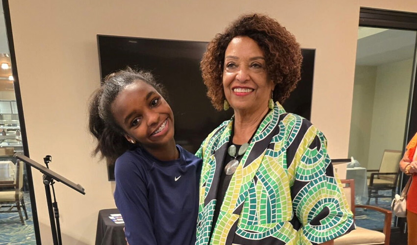 A grandchild with their grandparent.