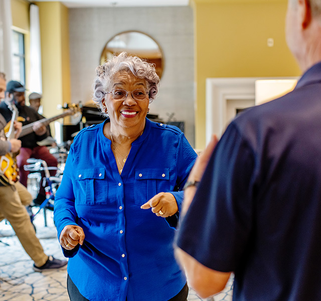 Residents dancing to live music.