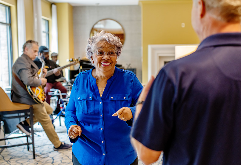 A live band playing music while residents dance.