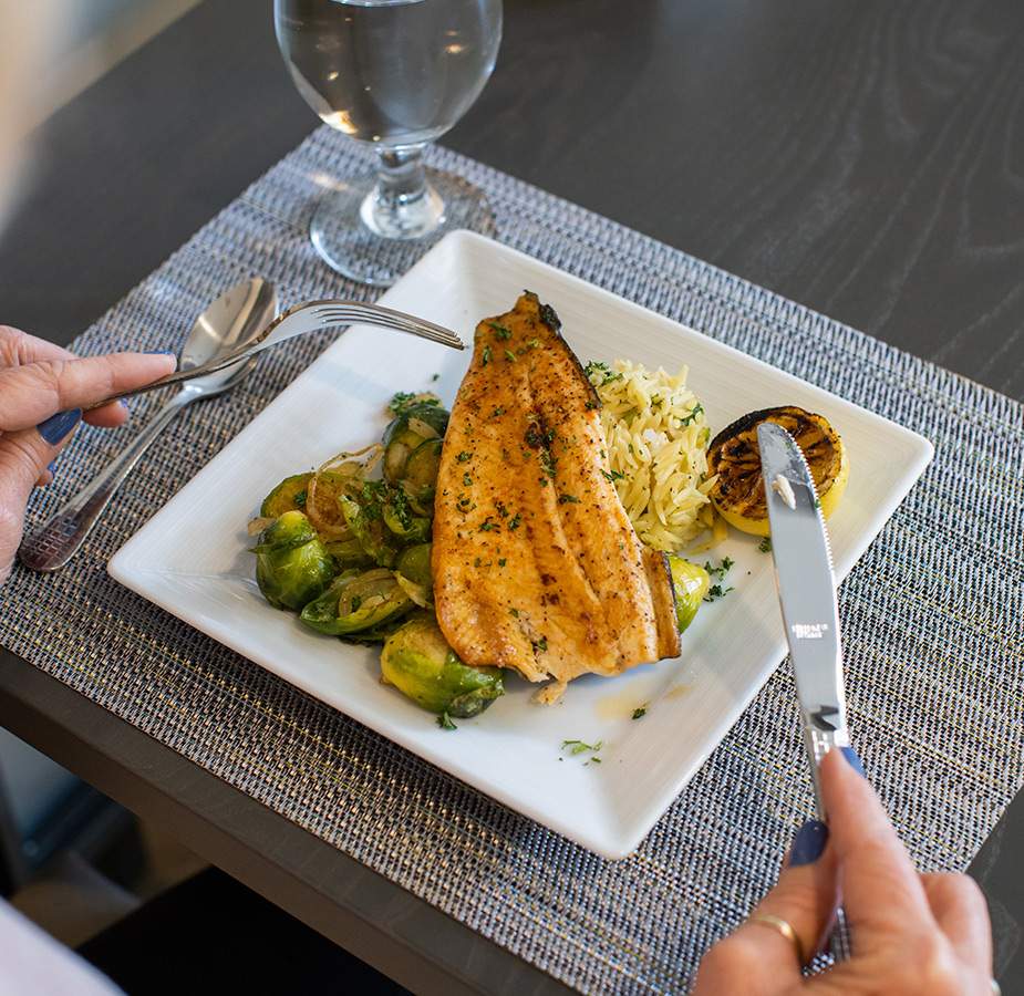 Grilled fish on a plate.