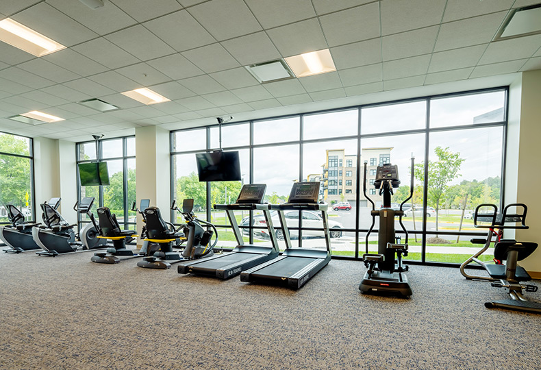 A fitness center with gym equipment.