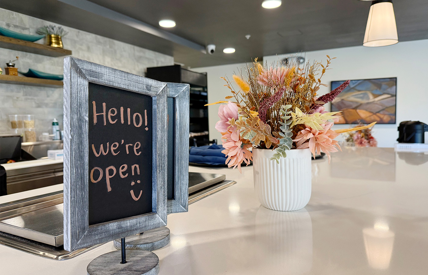 A sign on the counter in the cafe.