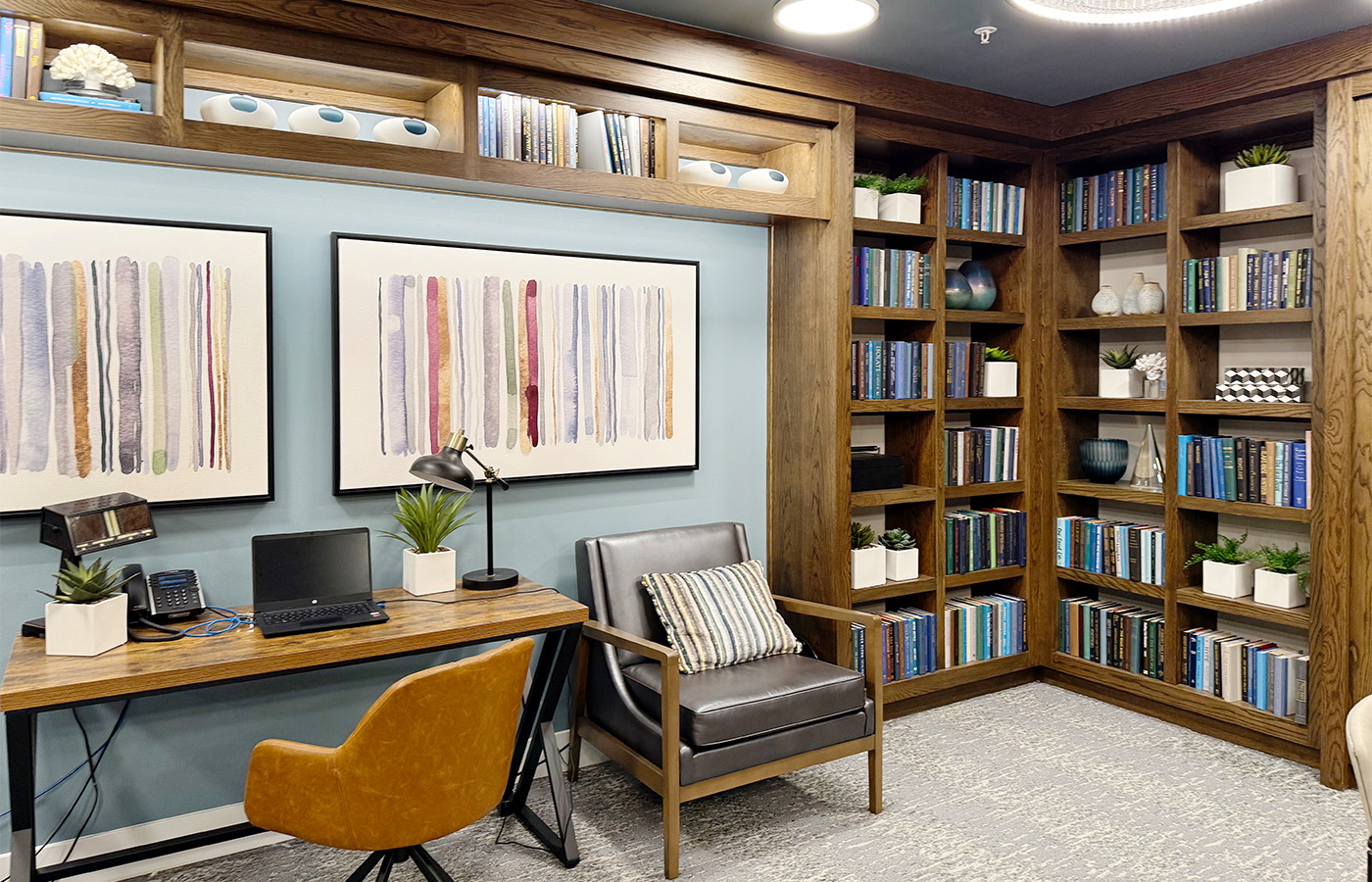 A desk in the library with a computer.
