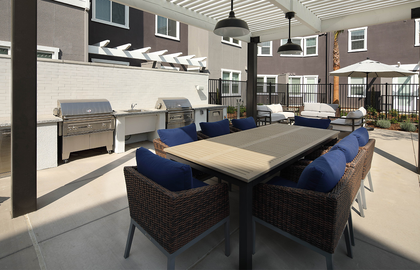 A patio with an outdoor kitchen grilling area.