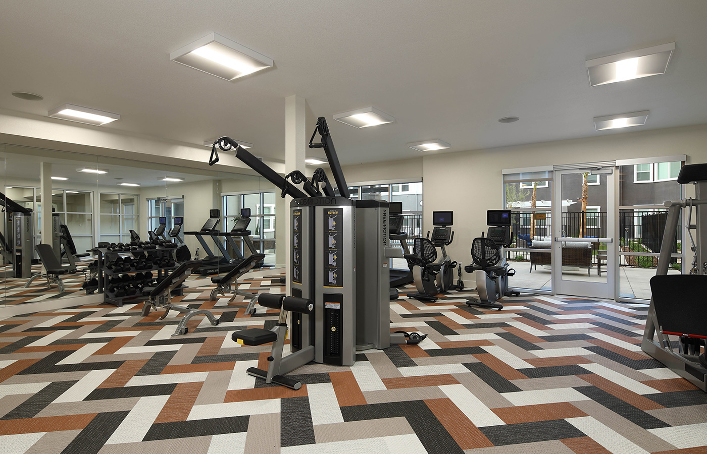 A fitness center with exercise equipment.