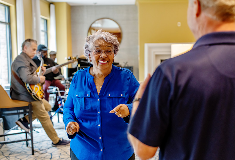 A resident dancing to live music.