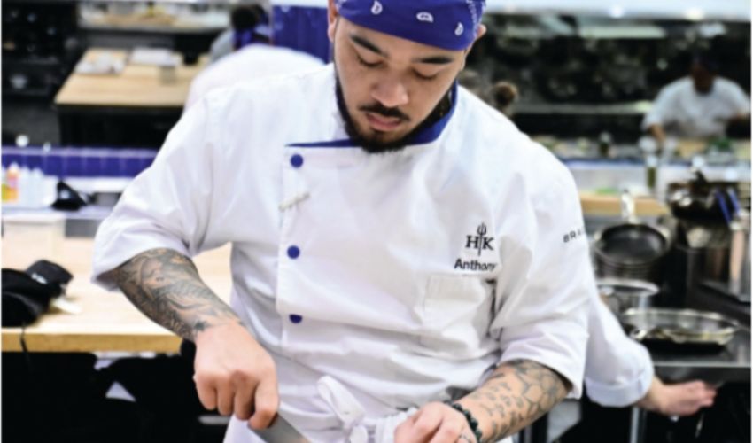 A chef working in a kitchen.