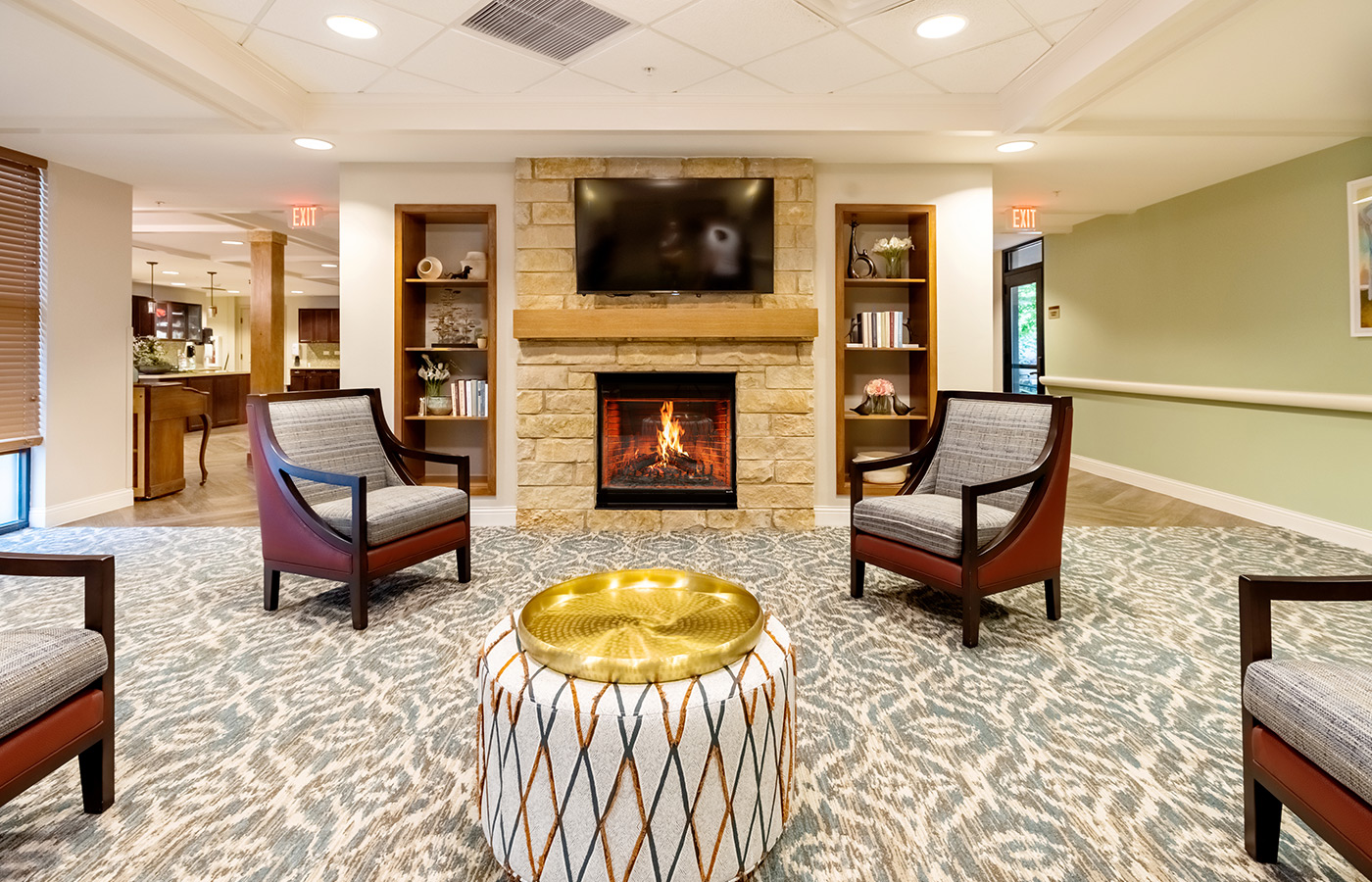A lounge area with seating and a fireplace.